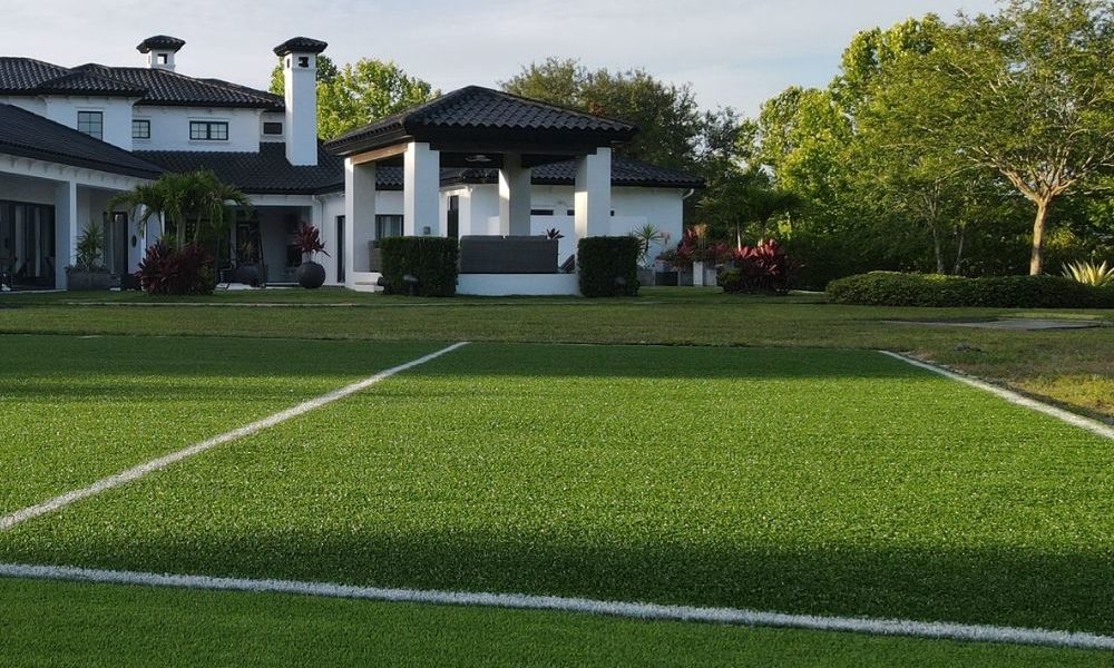 Sports field made out of artificial turf in a front yard